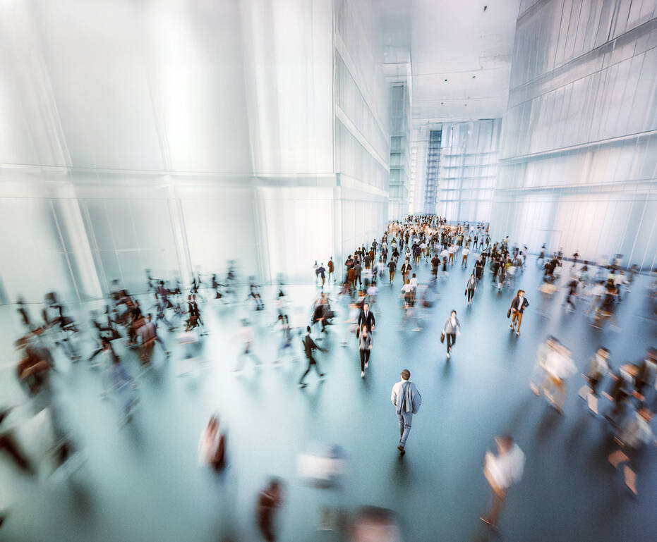 Aerial view of businesspeople walking through office lobby