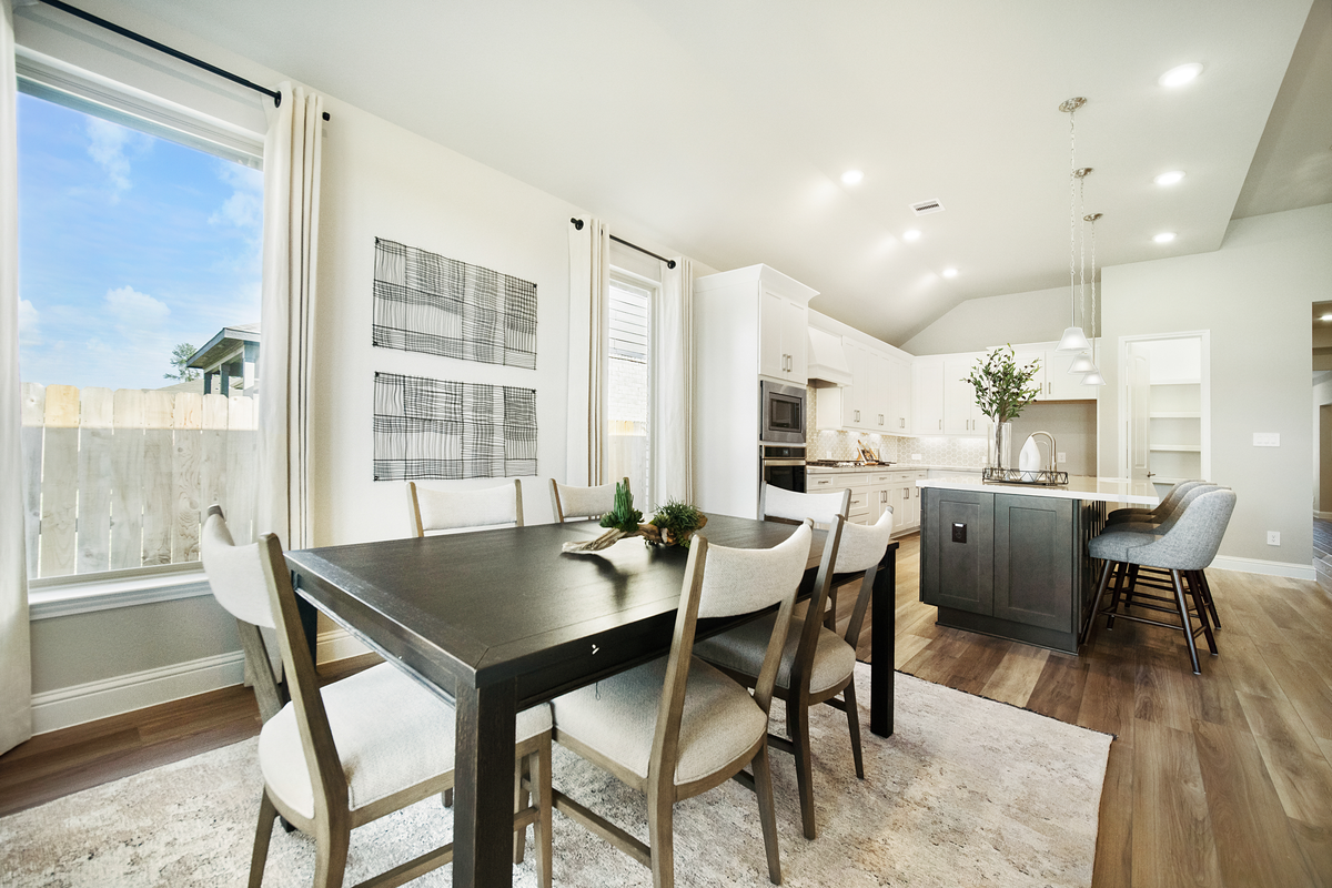 dining room with large window and curtains