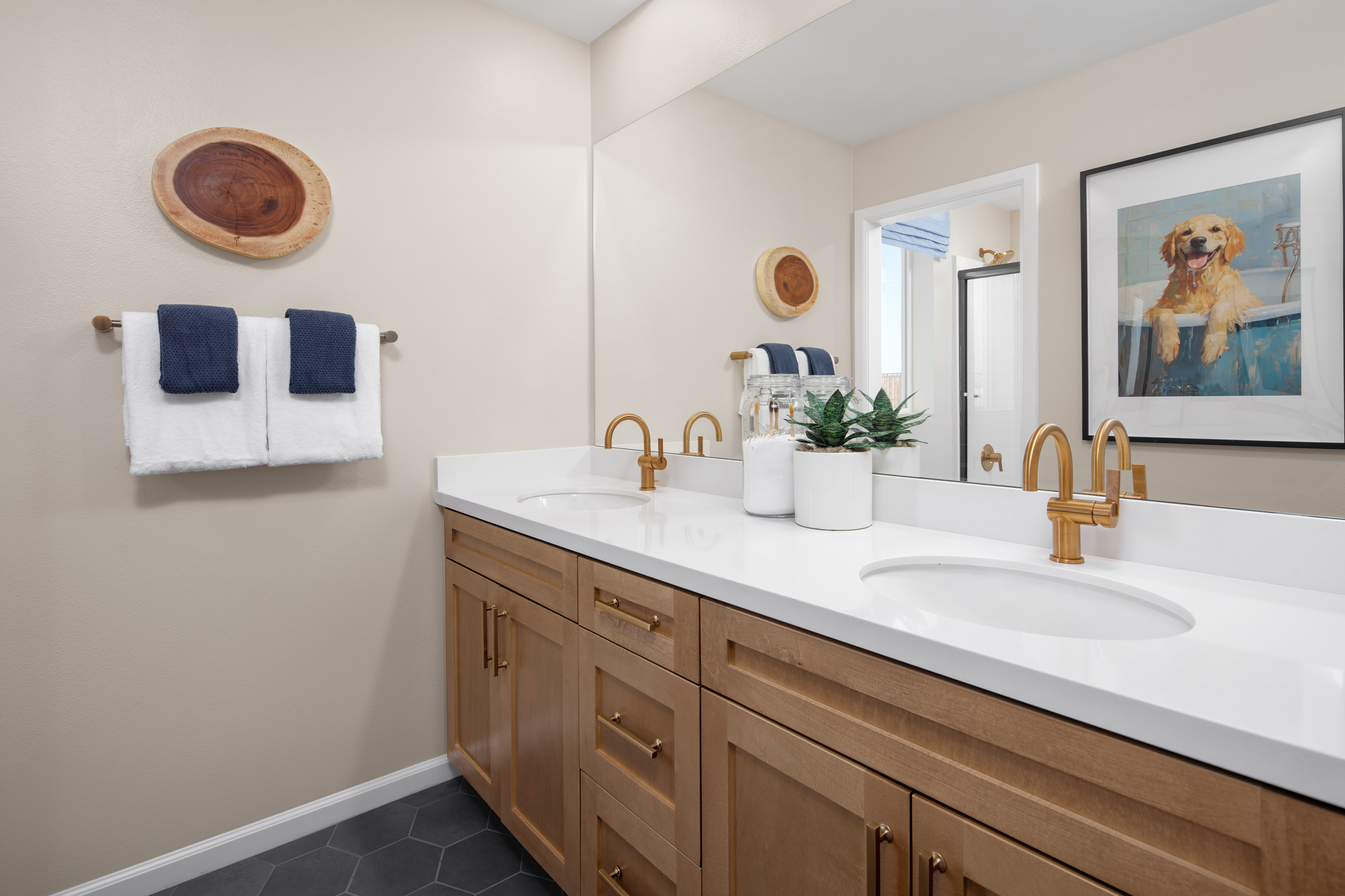 bathroom with tile floors and dual sinks