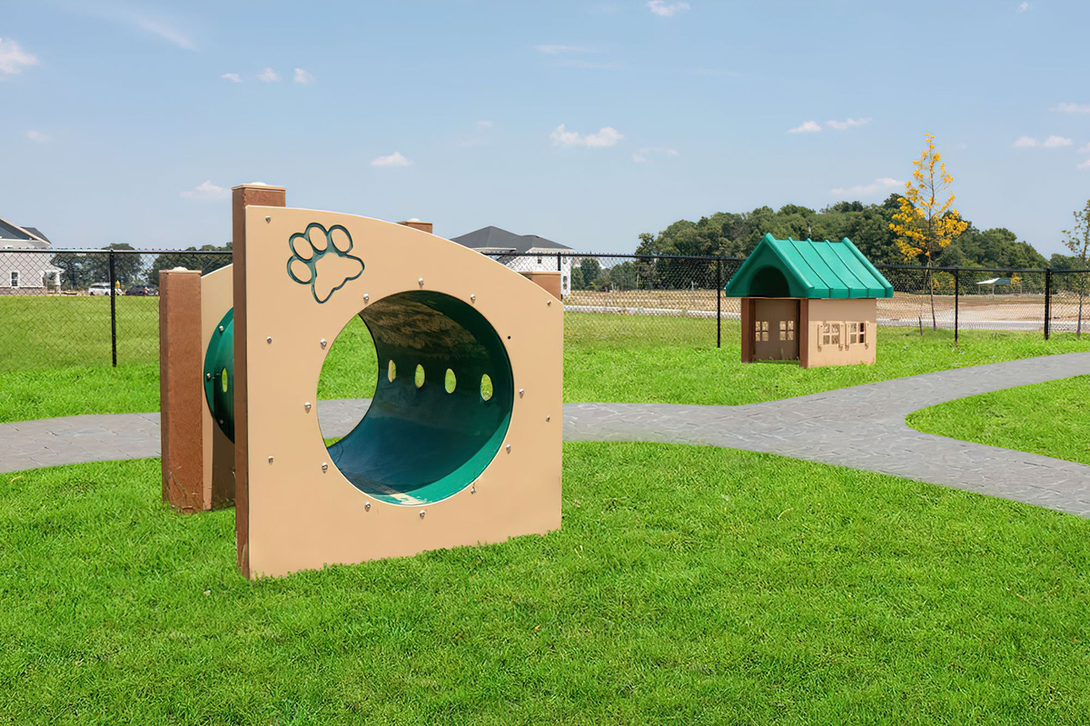 dog park with green grass and dog house 