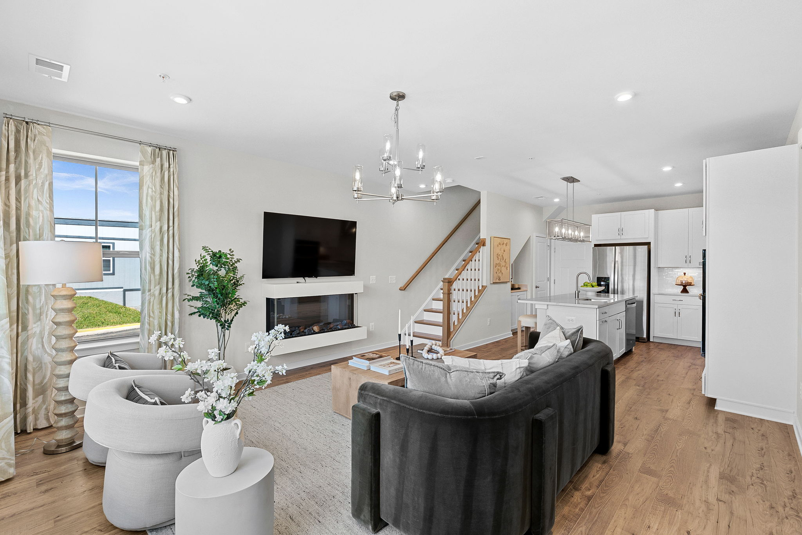 living room with couches and chairs