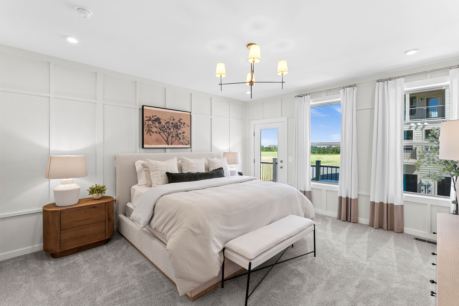 primary bedroom with bed and nightstand