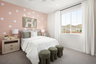 bedroom with neutral floors and accent wall