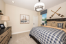 guest bedroom with carpet throughout and single window