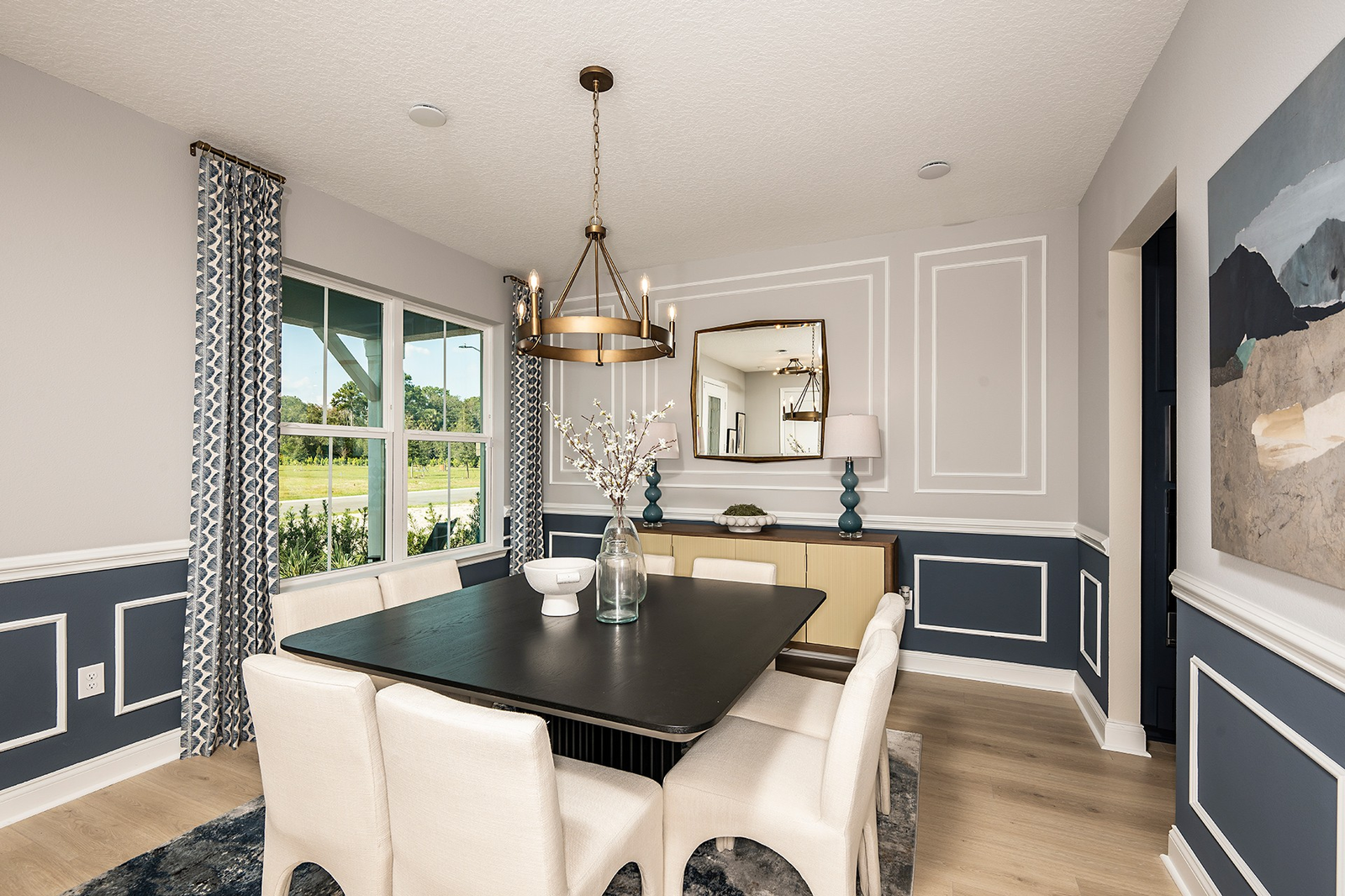 dining room with access to the kitchen and view of entrance 