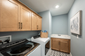 laundry room with sink and storage space