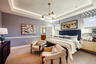 room with carpet throughout, tray ceilings and large windows.