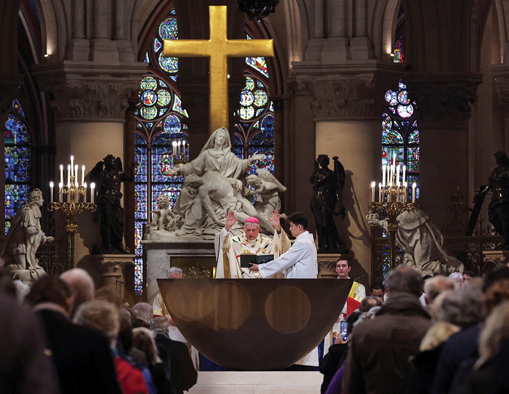 Archbishop Laurent Ulrich of Paris celebrates the inaugural Mass at the newly restored Notre-Dame Cathedral. The 18th-century statue of the Virgin of Pity, or Piet&agrave;, by French sculptor Nicolas Coustou, stands in the background. 