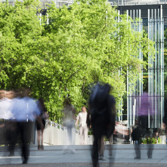 People in motion walking in financial district