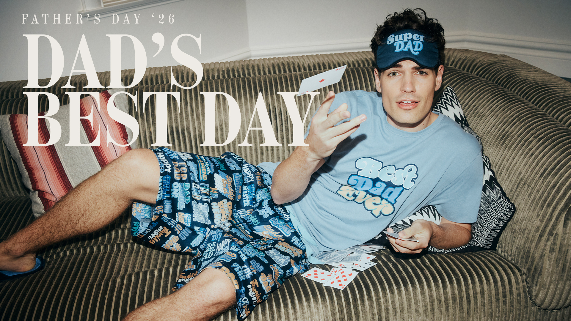 man lying on couch in Peter Alexander Father's Day pyjamas