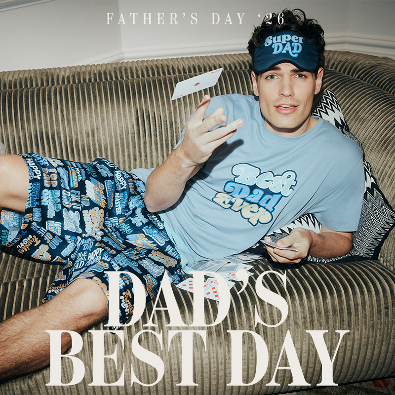 man lying on couch in Peter Alexander Father's Day pyjamas