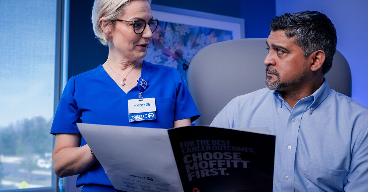 nurse goes over appointment instructions with patient