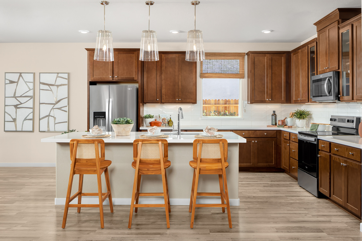 kitchen with brown cabinets, and white counters