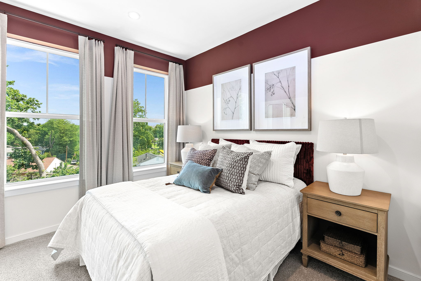 secondary bedroom with carpet and double windows