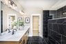 primary bathroom with dual vanity & walk-in shower