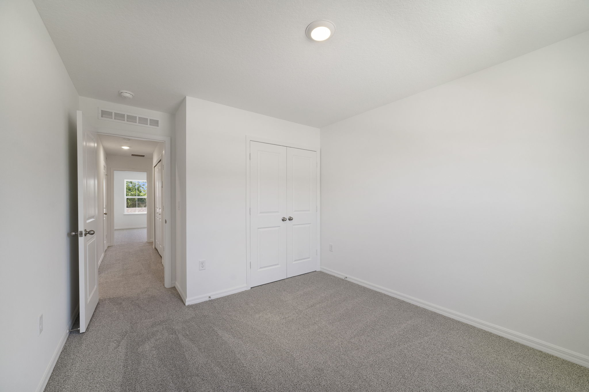 carpet throughout with a closet and a single window