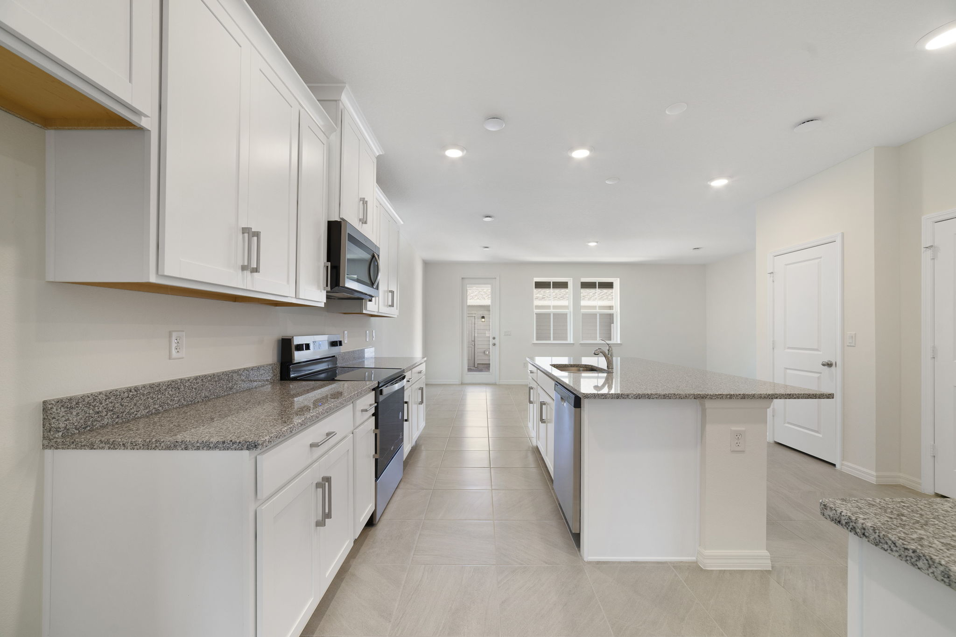 granite center island and stainless-steel appliances  