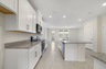 granite center island and stainless-steel appliances  