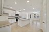granite center island and stainless-steel appliances  