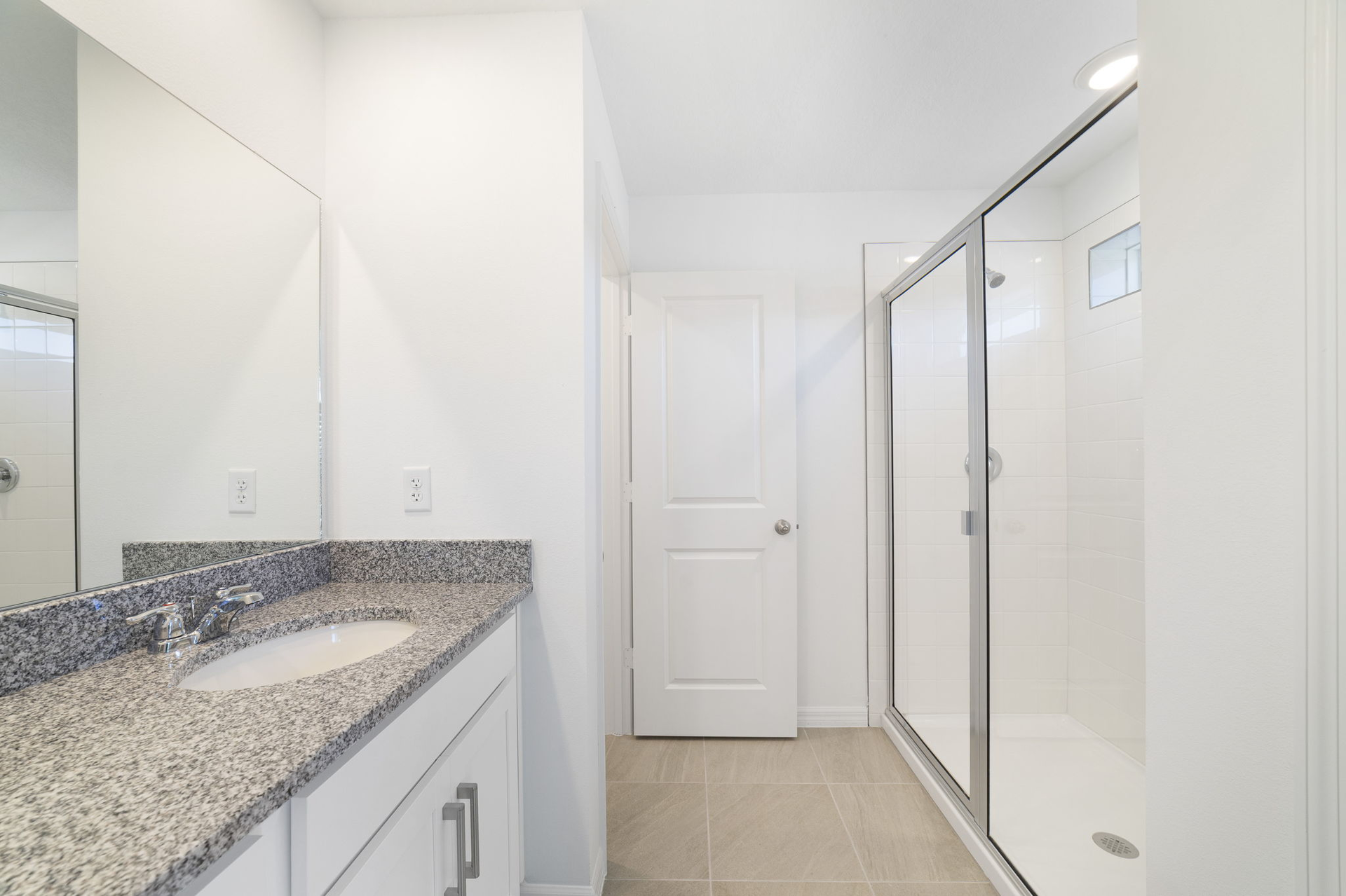 dual sink vanity with mirror and shower