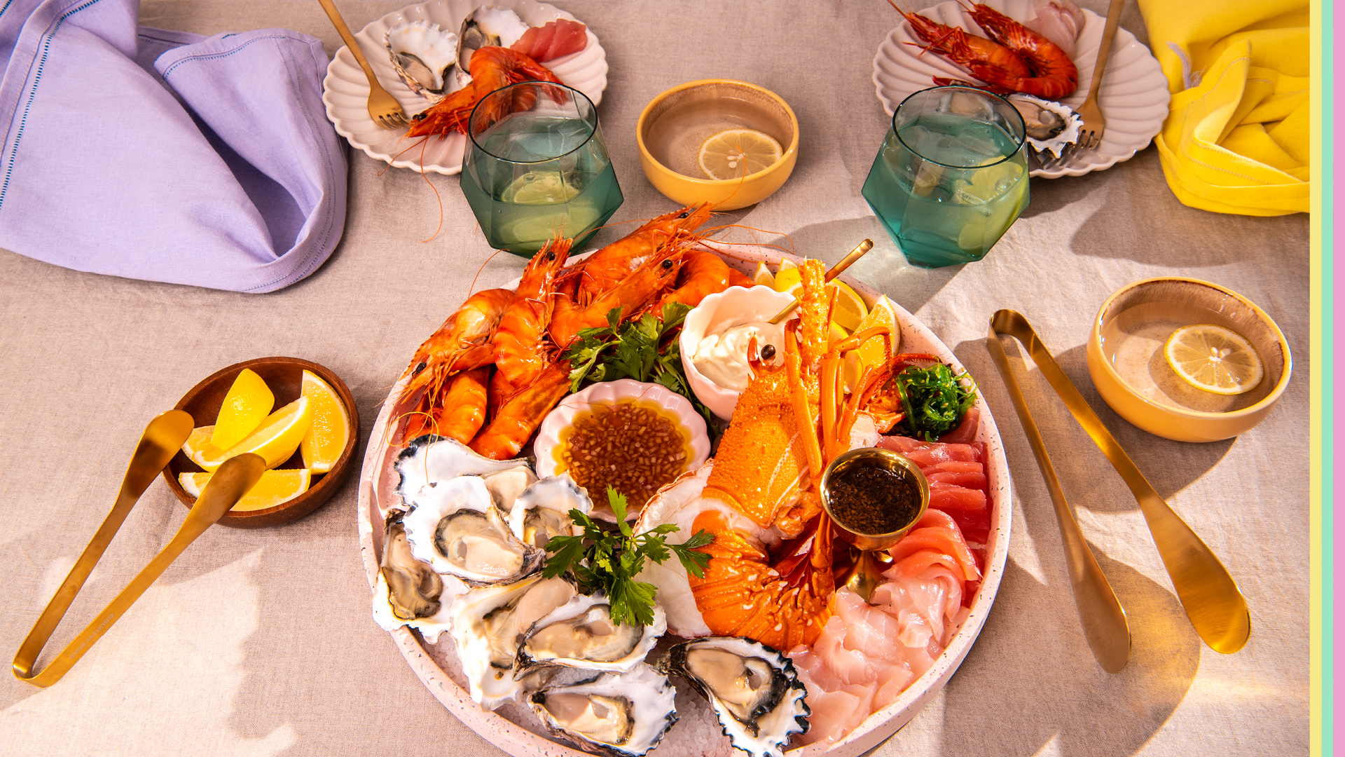 Seafood platter with prawns, oysters, lobster, kingfish and tuna sashimi served with dipping sauce