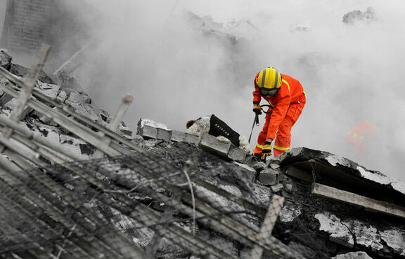 Firefighter doing recovery in destroyed building