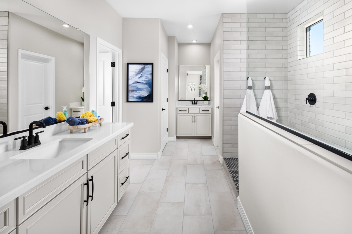spacious primary bathroom with soaking tub