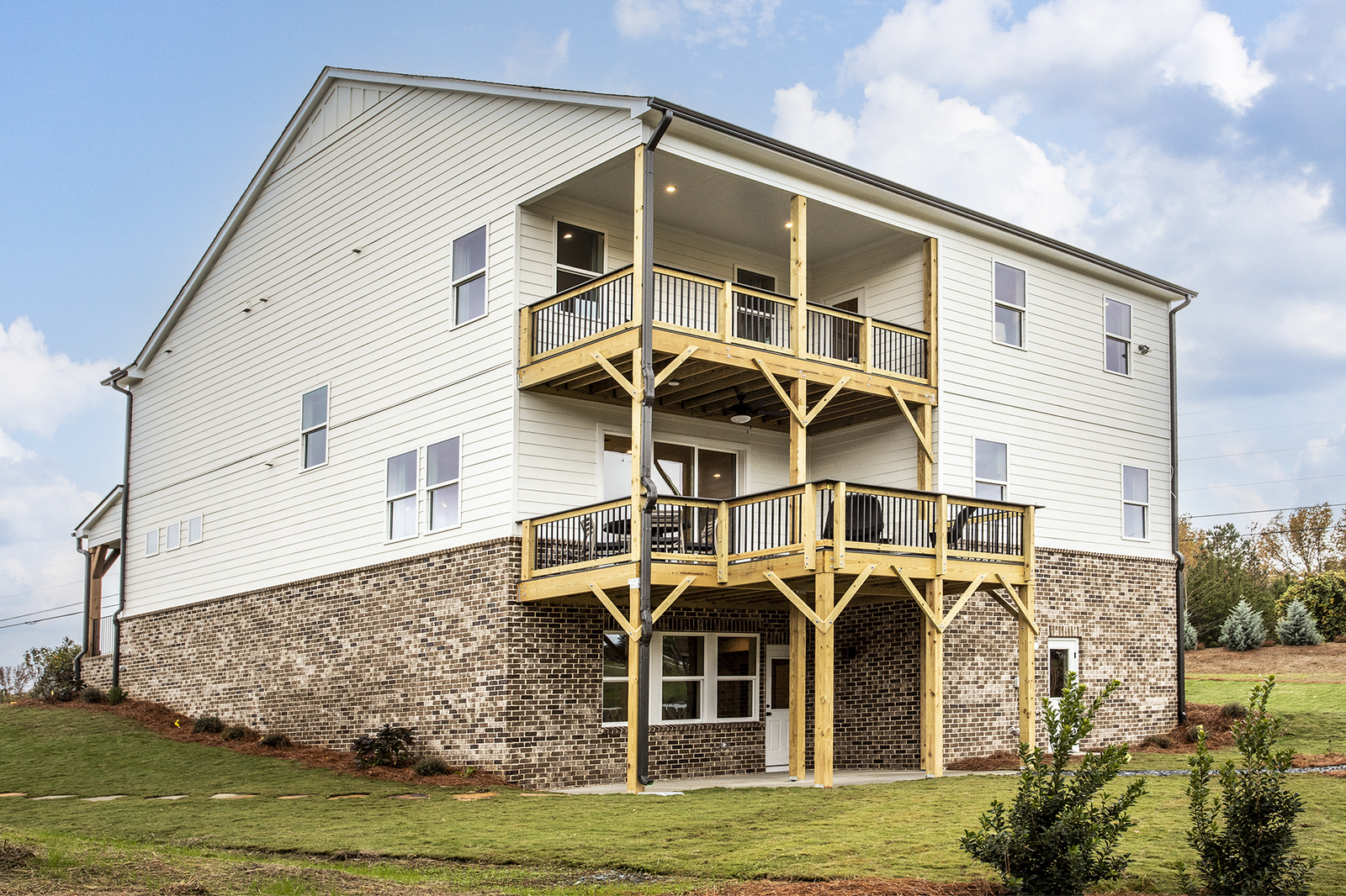 back of basement home with covered decks