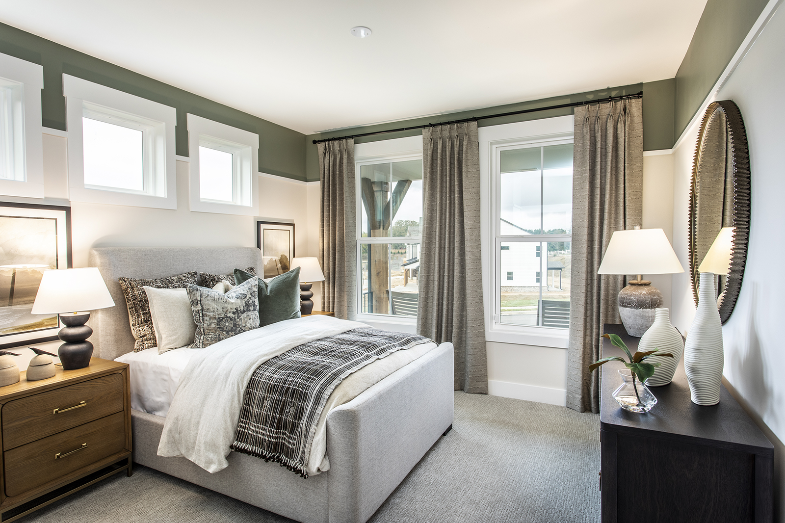 secondary bedroom with 2 windows & neutral carpet