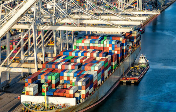Cargo ship being loaded by a container crane