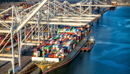 Cargo ship being loaded by a container crane