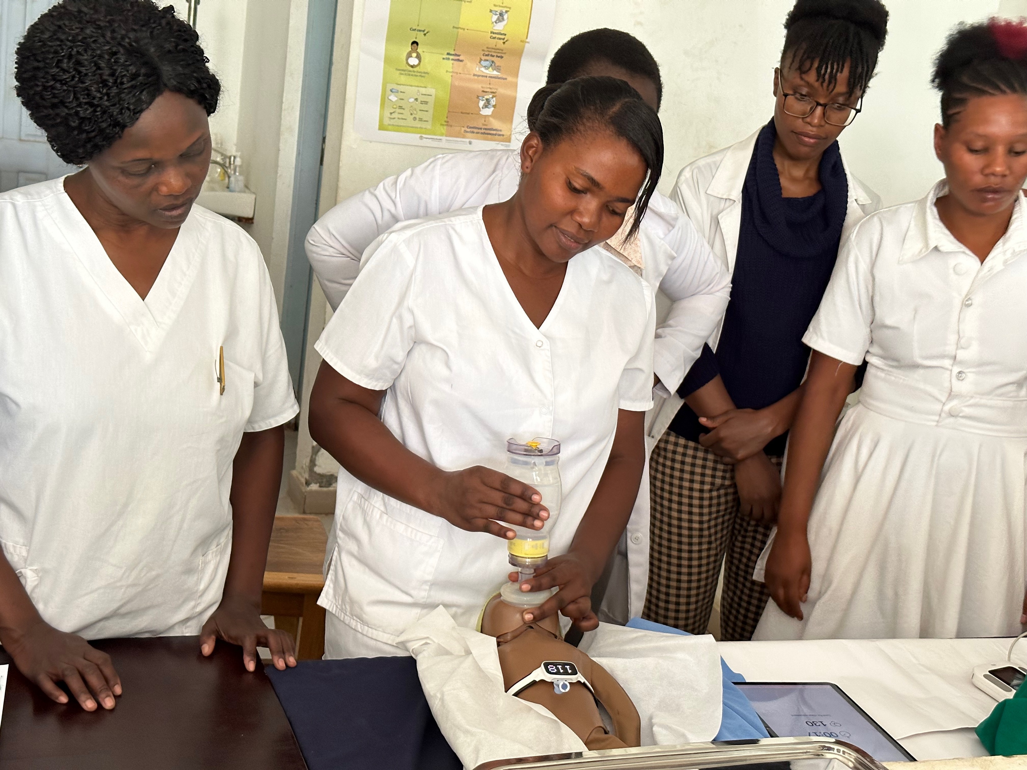 Health workers in the Safer Births Bundle of Care programme by Laerdal, in a simulation training with the new NeoNatalie Live newborn simulator, where they train on how to help babies breathe after birth.