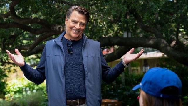 Ted McGinley as Derek with his hands up in a shrug in Shrinking