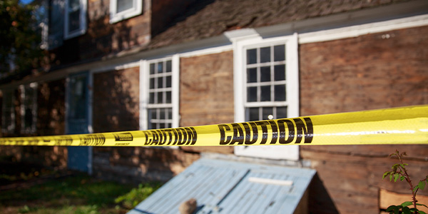 caution tape around a home