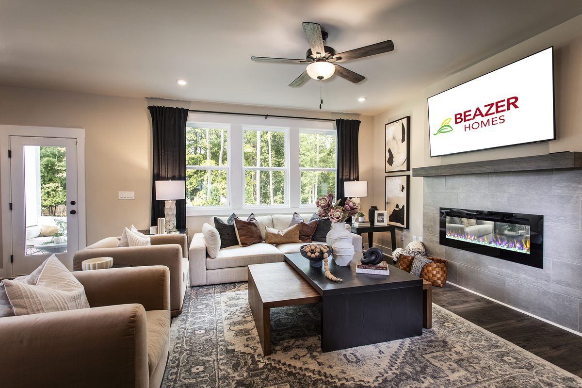 great room with fireplace and plank flooring
