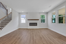great room with electric fireplace and hard surface flooring