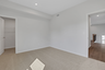 secondary bedroom with windows and carpet