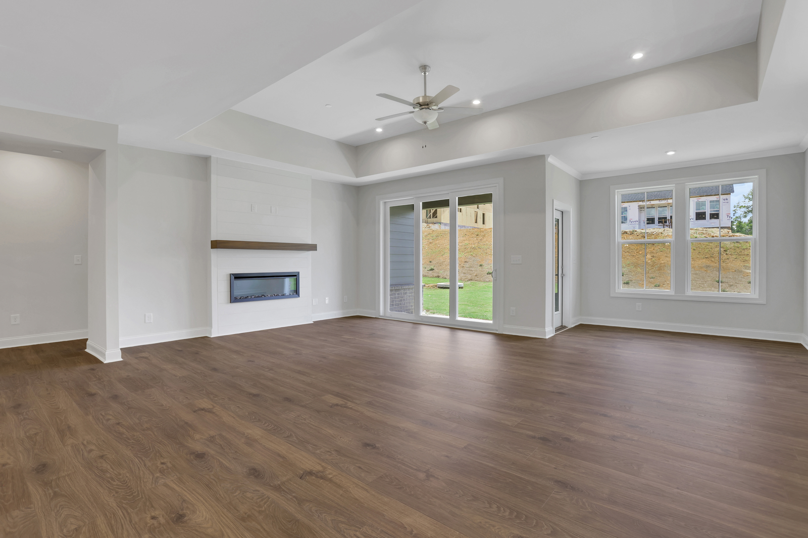 great room with electric fireplace and hard surface flooring