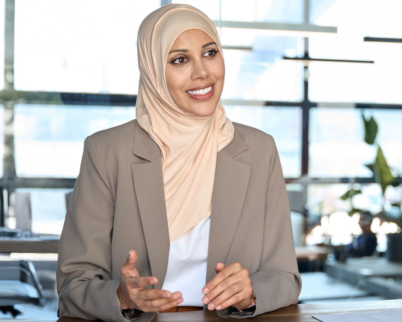 woman smiling with arms crossed