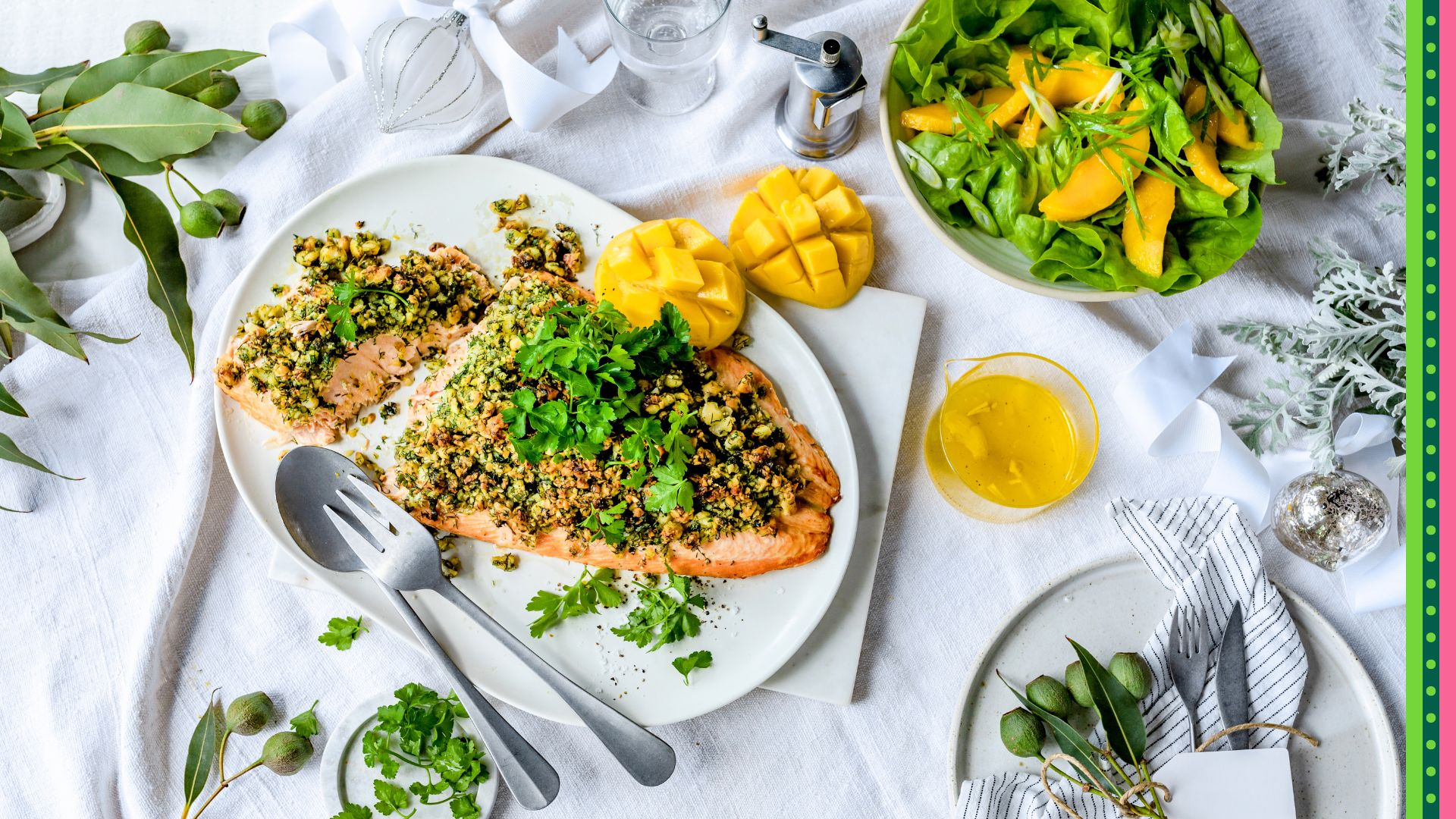 Christmas Lunch or Dinner Macadamia Crusted side of Salmon served on white plate with fresh mango, mango dressing and mango salad