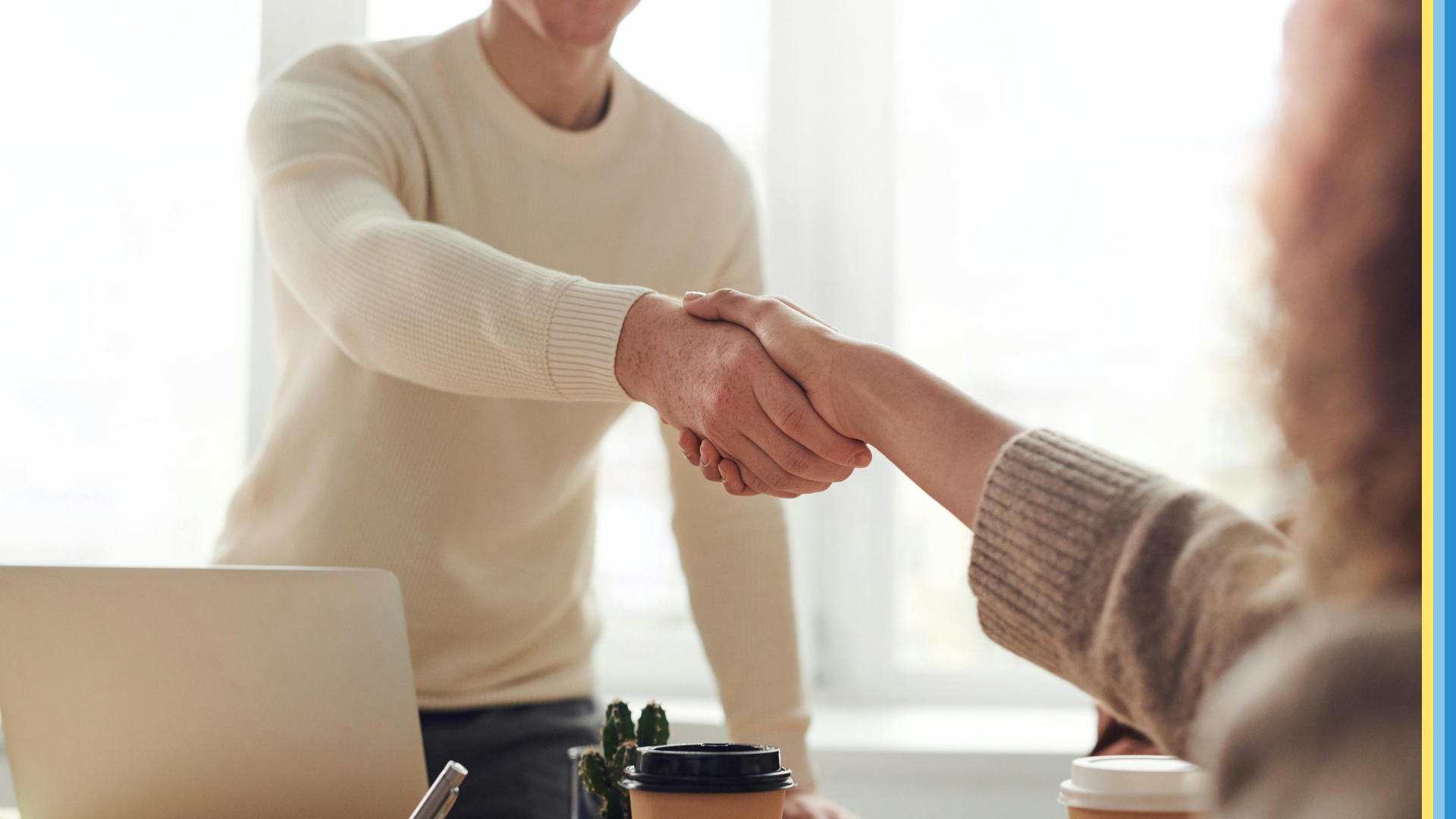 Man shaking hand with a job seeker after an interview.