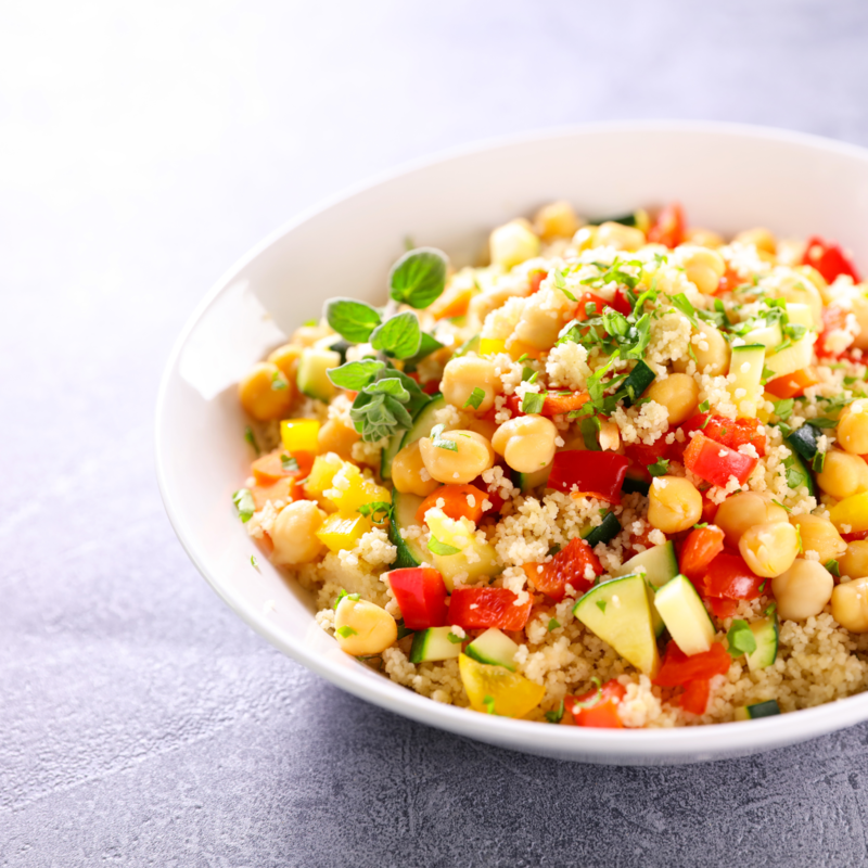 Close up of Nutrition Australia's Chickpea and Couscous Salad served on white plate.