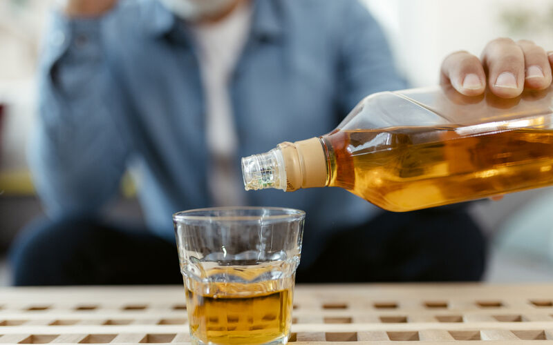 Pouring glass of whiskey 