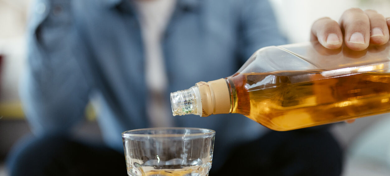 Pouring glass of whiskey 