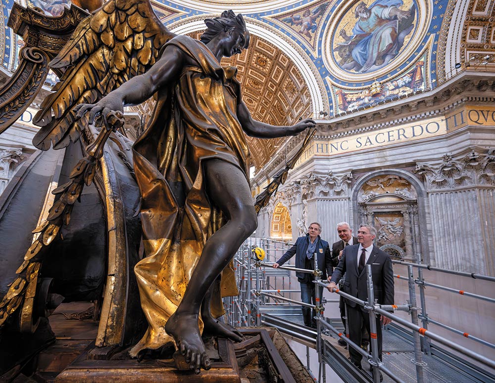 Supreme Knight Patrick Kelly inspects restoration work on the baldacchino over the main altar in St. Peter&rsquo;s Basilica on June 26. Also pictured are Alberto Capitanucci (left) and Dr. Pietro Zander, executives of the Fabbrica di San Pietro. (Photo by Tamino Petelin&scaron;ek)