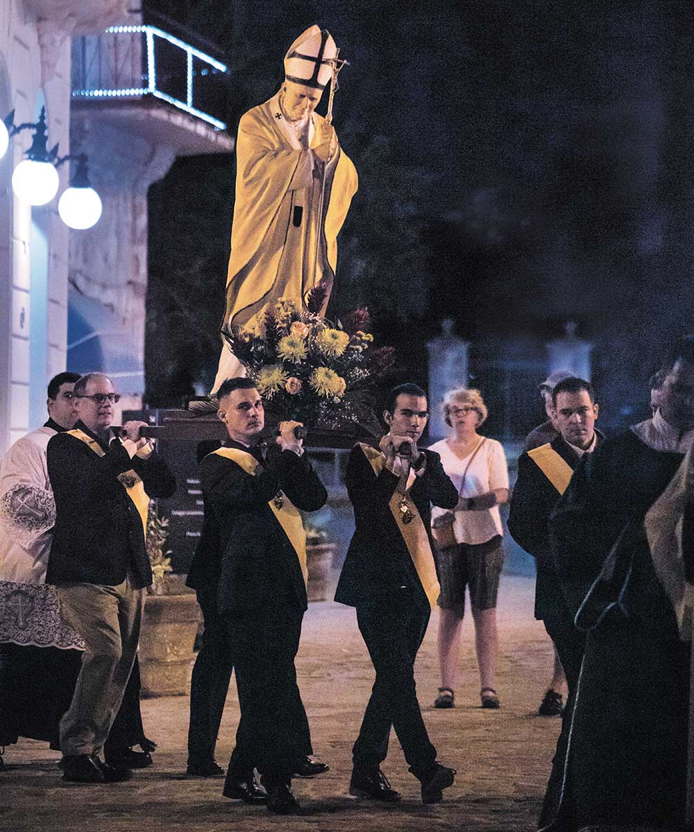 Members of San Agust&iacute;n Council 1390 in Havana, Cuba, carry a statue of St. John Paul II around Havana Cathedral following a Mass in January 2023 that marked the 25th anniversary of the pope&rsquo;s apostolic journey to Cuba. (Photo by Adrian Mart&iacute;nez C&aacute;diz)