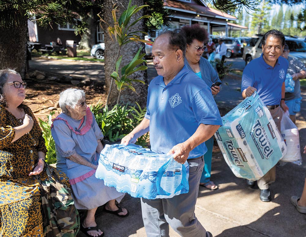 Knights unload supplies for victims of the wildfires at Sacred Hearts Mission Church in Kapalua. (Photo by Marco Garcia)