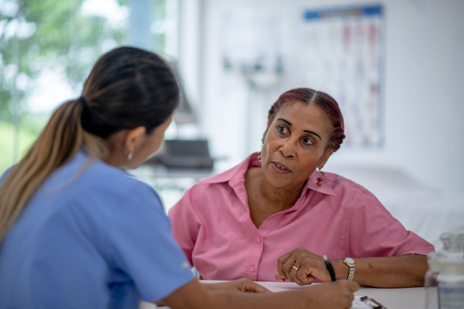 Nurse reviews appendix cancer causes with patient