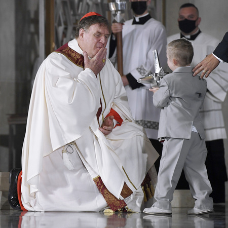 Michael “Mikey” Schachle presents a relic of Blessed Michael McGivney to Cardinal Joseph Tobin during the Mass of Beatification on October 31, 2020.