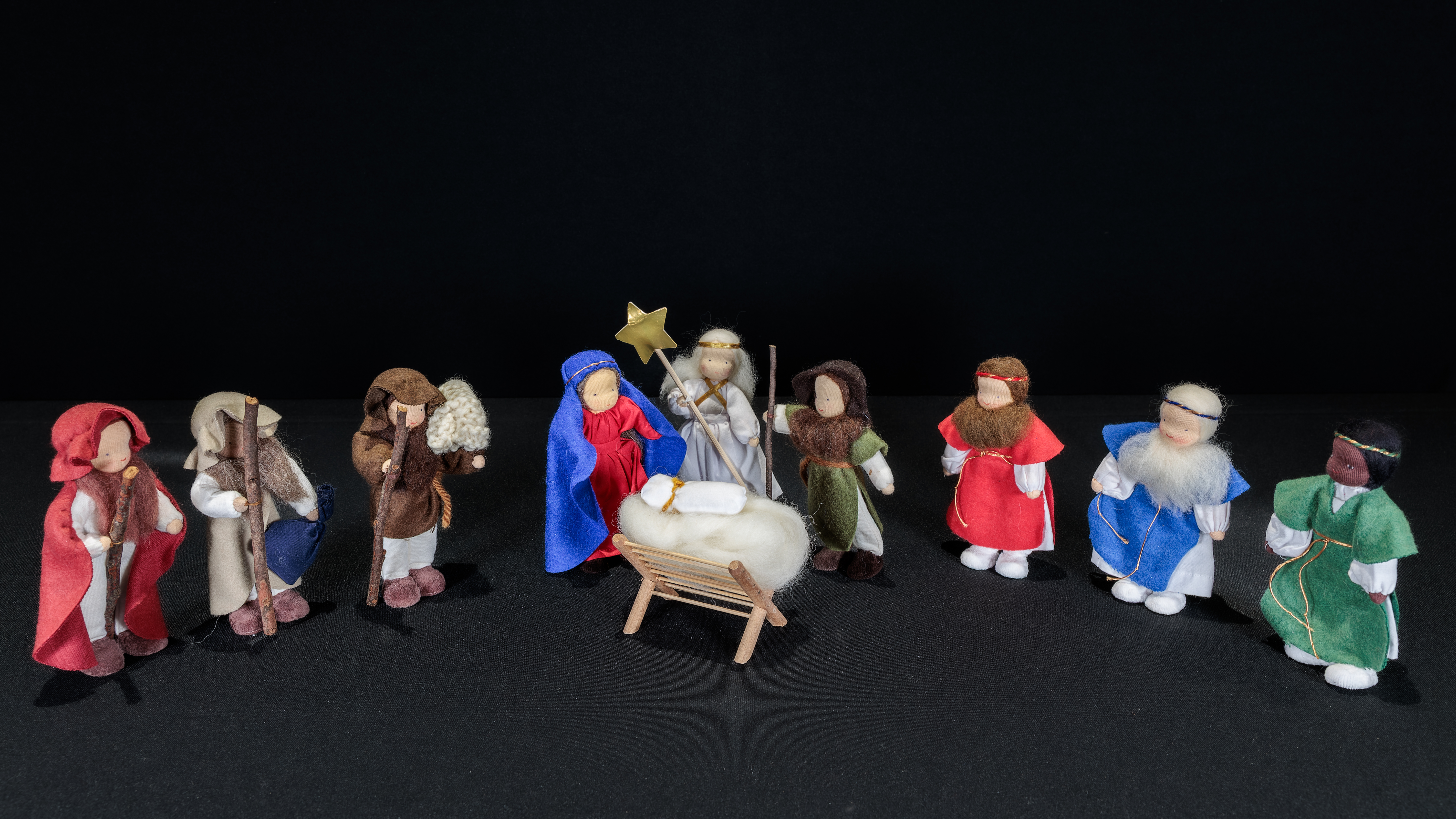 Wool Nativity scene from Brazil featuring the Holy Family, Angel, three Magi, and three Shepherds.